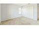 Bright bedroom features a window and closet doors, providing ample storage space and natural light at 1769 Strathmore Cir, Mount Dora, FL 32757