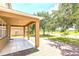 Inviting covered patio overlooking the backyard at 1769 Strathmore Cir, Mount Dora, FL 32757