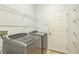 Laundry room featuring a front-load washer and dryer and wire shelving at 1769 Strathmore Cir, Mount Dora, FL 32757