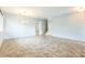 Spacious living area featuring tile flooring, a modern chandelier, and a staircase leading to the upper level at 1769 Strathmore Cir, Mount Dora, FL 32757