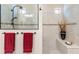 Beautifully tiled walk-in shower with built-in bench and dual shower heads at 224 Granada Ln, Davenport, FL 33837