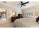 A well lit bedroom with a ceiling fan at 224 Granada Ln, Davenport, FL 33837