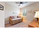 This cozy bedroom features a daybed, plush carpet, a ceiling fan, and plantation shutters at 224 Granada Ln, Davenport, FL 33837