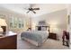 A well lit bedroom with a ceiling fan at 224 Granada Ln, Davenport, FL 33837