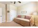 Comfortable bedroom with neutral tones, features a daybed and charming decor at 224 Granada Ln, Davenport, FL 33837