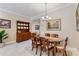 Elegant dining room with a classic wooden table set and decorative china cabinet at 224 Granada Ln, Davenport, FL 33837