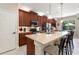 Spacious kitchen features a large island, stainless steel appliances, and abundant counter space at 224 Granada Ln, Davenport, FL 33837
