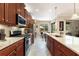 Spacious kitchen featuring granite counters, stainless steel appliances, and ample cabinet space at 224 Granada Ln, Davenport, FL 33837