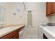 The laundry room includes a sink, washer and dryer at 224 Granada Ln, Davenport, FL 33837