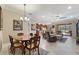 Open-concept living area with dining space, kitchen, and comfortable seating at 224 Granada Ln, Davenport, FL 33837