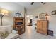 Comfortable seating area with a bookcase, and view of a dining and living area at 224 Granada Ln, Davenport, FL 33837
