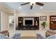 Inviting living room featuring a built-in entertainment center and cozy furnishings at 224 Granada Ln, Davenport, FL 33837