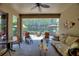 Spacious screened patio with comfortable seating and a view of the backyard and nearby swimming pool at 224 Granada Ln, Davenport, FL 33837