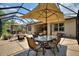 Spacious screened-in patio with dining & lounge areas for outdoor enjoyment at 224 Granada Ln, Davenport, FL 33837