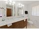 Bathroom featuring a double sink vanity with marble countertop, tiled floors, and modern fixtures at 3100 Peacock Ln, Mulberry, FL 33860