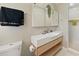 Modern bathroom featuring a sleek floating vanity, contemporary fixtures, and a mirrored medicine cabinet at 3100 Peacock Ln, Mulberry, FL 33860