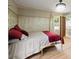 Stylish bedroom with hardwood floors, canopy bed, and ensuite bathroom access at 3100 Peacock Ln, Mulberry, FL 33860