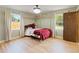 Bedroom featuring a statement canopy bed, natural light, and beautiful hardwood floors at 3100 Peacock Ln, Mulberry, FL 33860