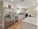 Bright kitchen features stainless steel appliances, modern cabinets, and a window above the sink at 3100 Peacock Ln, Mulberry, FL 33860
