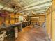 The shed interior features shelving, storage, and a workspace for hobbies and projects at 3100 Peacock Ln, Mulberry, FL 33860