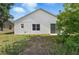 Home with a backyard view from the exterior featuring sliding glass doors that provide natural light at 442 Graystone Blvd, Davenport, FL 33837