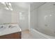 Bright bathroom featuring a large vanity, tub, and window for natural light at 442 Graystone Blvd, Davenport, FL 33837