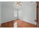 Bright bedroom featuring wood floors, a ceiling fan, and window for natural light at 442 Graystone Blvd, Davenport, FL 33837