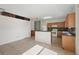 Expansive kitchen featuring a breakfast bar, tile floors, and seamless access to adjacent spaces at 442 Graystone Blvd, Davenport, FL 33837