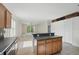 The kitchen's breakfast bar overlooks the living area for an open-concept feel at 442 Graystone Blvd, Davenport, FL 33837