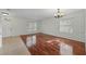 Sun-filled living area features hardwood floors, abundant natural light, and a classic chandelier at 442 Graystone Blvd, Davenport, FL 33837