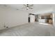 An airy living room showcases an open layout, ceiling fan, and easy access to the kitchen at 442 Graystone Blvd, Davenport, FL 33837