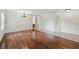 Spacious living room with wood floors, chandelier, and large window at 442 Graystone Blvd, Davenport, FL 33837