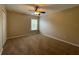 Bedroom with neutral walls, carpet, a ceiling fan, and natural light from the window at 10303 Park Commons Dr, Orlando, FL 32832