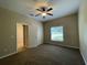 Bedroom with neutral walls, carpet flooring, and natural light, creating a serene atmosphere at 10303 Park Commons Dr, Orlando, FL 32832