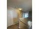Bright hallway featuring neutral walls and carpet flooring with a closet visible at 10303 Park Commons Dr, Orlando, FL 32832