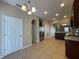 Well-equipped kitchen boasts stainless steel appliances, granite countertops, and tile flooring at 10303 Park Commons Dr, Orlando, FL 32832