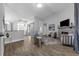 Inviting living room with stone fireplace and open layout, perfect for entertaining at 10421 Mesa Ln, Clermont, FL 34711