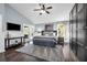 Light-filled main bedroom with backyard access, ceiling fan, and expansive closet storage at 10421 Mesa Ln, Clermont, FL 34711
