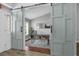 Bright home office featuring sliding barn doors, stylish desk, and comfortable workspace at 10421 Mesa Ln, Clermont, FL 34711