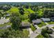 Aerial view shows a residential area with houses, green spaces, and solar panels at 1110 Waterview E Blvd, Lakeland, FL 33801