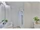 Tiled bathroom features sink, vanity and shower with white curtain at 1110 Waterview E Blvd, Lakeland, FL 33801