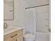 Bathroom features a shower-tub combination, tile floors, and a modern vanity at 1110 Waterview E Blvd, Lakeland, FL 33801