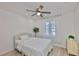 Bright bedroom features ceiling fan, large window, and neutral decor at 1110 Waterview E Blvd, Lakeland, FL 33801