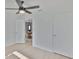 Bedroom with wood-look floors and an open doorway view to the dining room at 1110 Waterview E Blvd, Lakeland, FL 33801