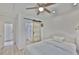Comfortable bedroom with ceiling fan and access to bathroom with barn door at 1110 Waterview E Blvd, Lakeland, FL 33801