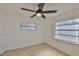 Bedroom boasts lots of light with a ceiling fan and two windows at 1110 Waterview E Blvd, Lakeland, FL 33801