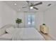 Bright bedroom featuring ceiling fan, window, and neutral decor at 1110 Waterview E Blvd, Lakeland, FL 33801