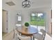 Dining area showcasing table, chairs, and sliding glass door to the backyard at 1110 Waterview E Blvd, Lakeland, FL 33801