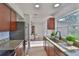Well-lit kitchen features granite countertops, stainless steel appliances, and hardwood floors at 1110 Waterview E Blvd, Lakeland, FL 33801