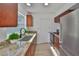 Kitchen features granite countertops, stainless steel appliances, and ample cabinet space at 1110 Waterview E Blvd, Lakeland, FL 33801